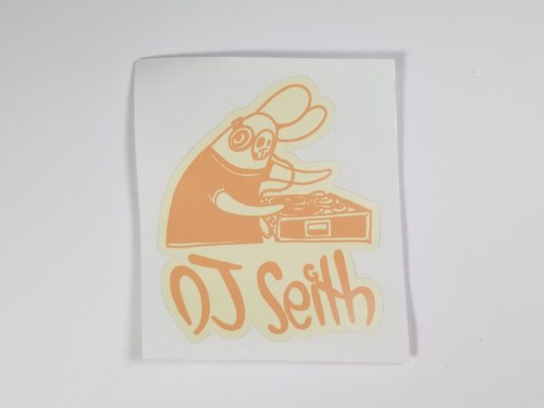 Sticker of Skullbunny on Turntables with caption "DJ Seith" underneath, Tan on Light Tan